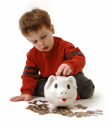 toddler boy with piggy bank