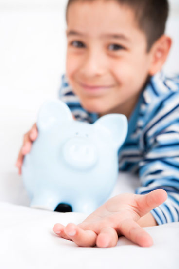Boy with his piggy bank