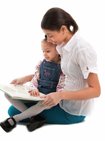 mom reading to preschool girl