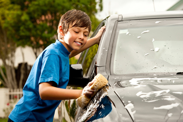 Middle Years Boy Washing a Car