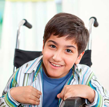Young teen boy in wheelchair
